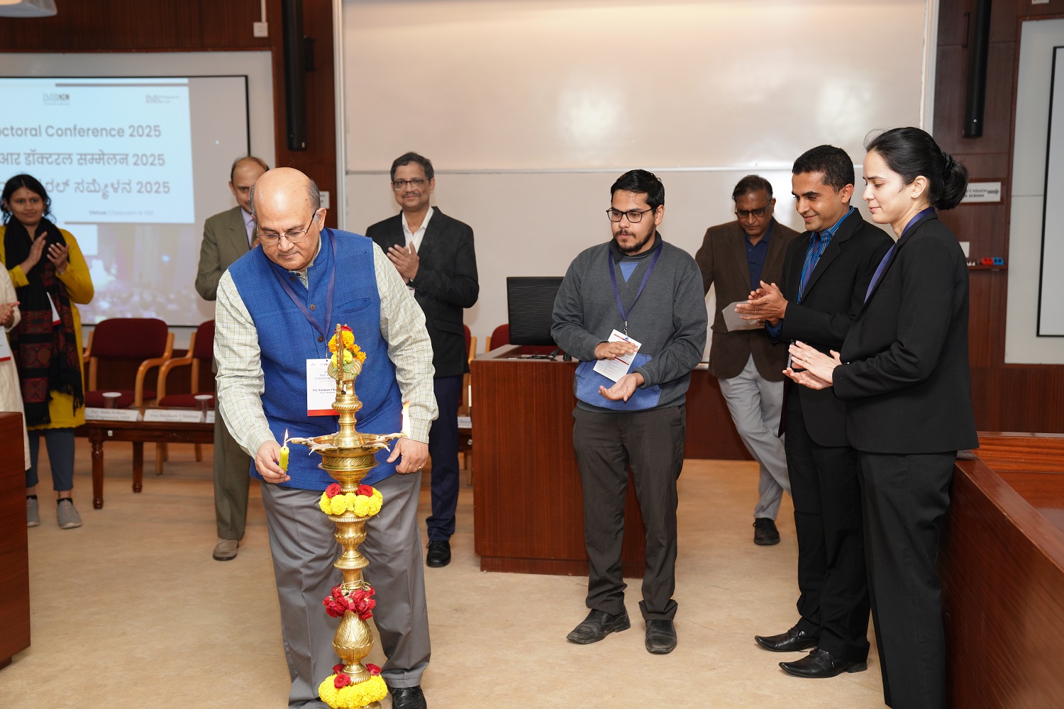 Inauguration ceremony of IMR Doctoral Conference (IMRDC) 2025 at IIM Bangalore, featuring keynote speakers and attendees.