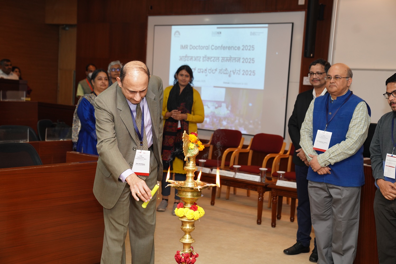 Inauguration ceremony of IMR Doctoral Conference (IMRDC) 2025 at IIM Bangalore, featuring keynote speakers and attendees.