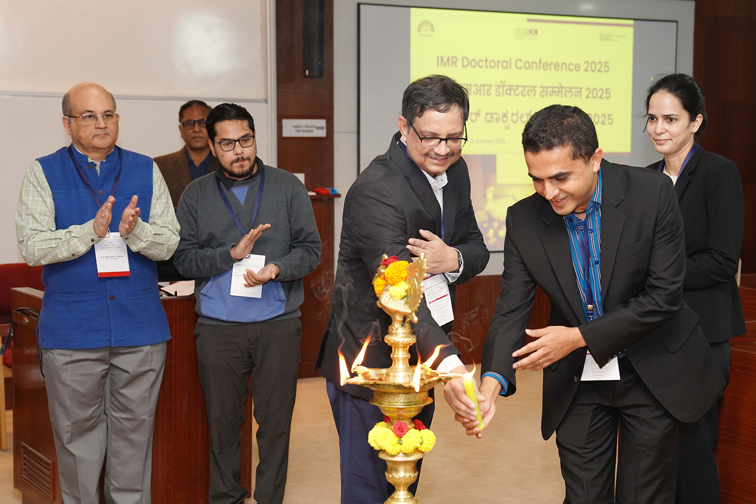 Inauguration ceremony of IMR Doctoral Conference (IMRDC) 2025 at IIM Bangalore, featuring keynote speakers and attendees.