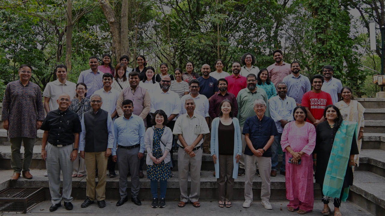 Walkway with plants growing on the side at Indian Institute of Management, Bangalore.