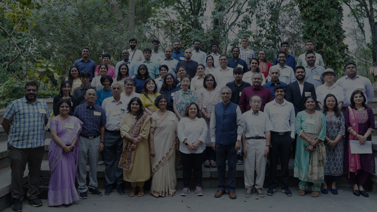 Walkway with plants growing on the side at Indian Institute of Management, Bangalore.