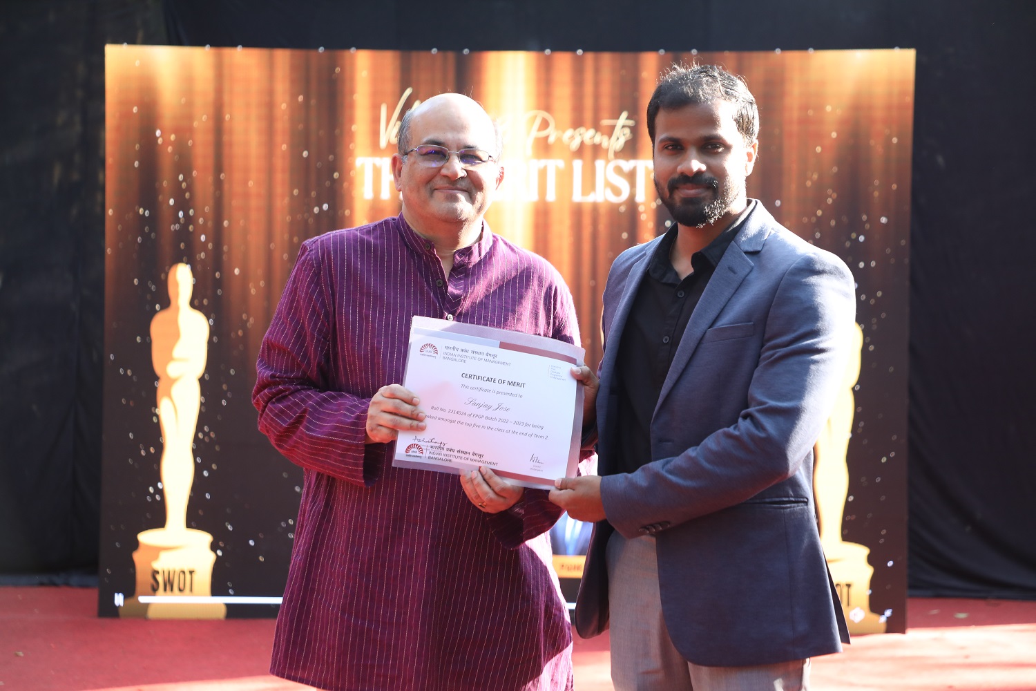 Prof. Rishikesha T Krishnan, Director, IIM Bangalore, hands over the Certificate of Merit to one of the Top 5 students of the 2022-2023 batch of EPGP, as part of the celebrations during Vihaan '23.