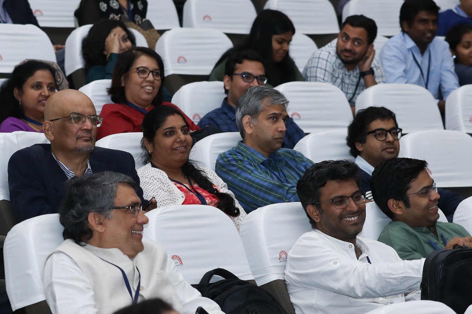 A member of the audience interacts with speakers.