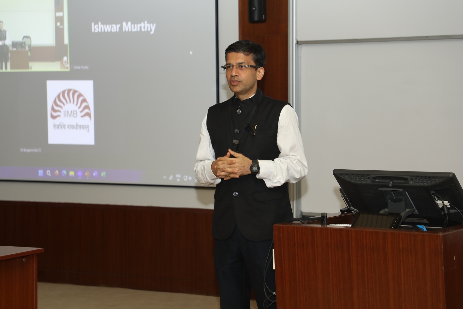 Prof. Sourav Mukherji, Dean Alumni Relations and Development , IIMB, welcomes faculty members and his former teachers to the Guru Purnima event on July 31, 2023.