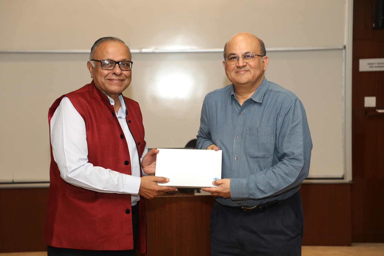 Prof. N.M. Agrawal is felicitated by the IIMB Director, Prof. RT Krishnan.