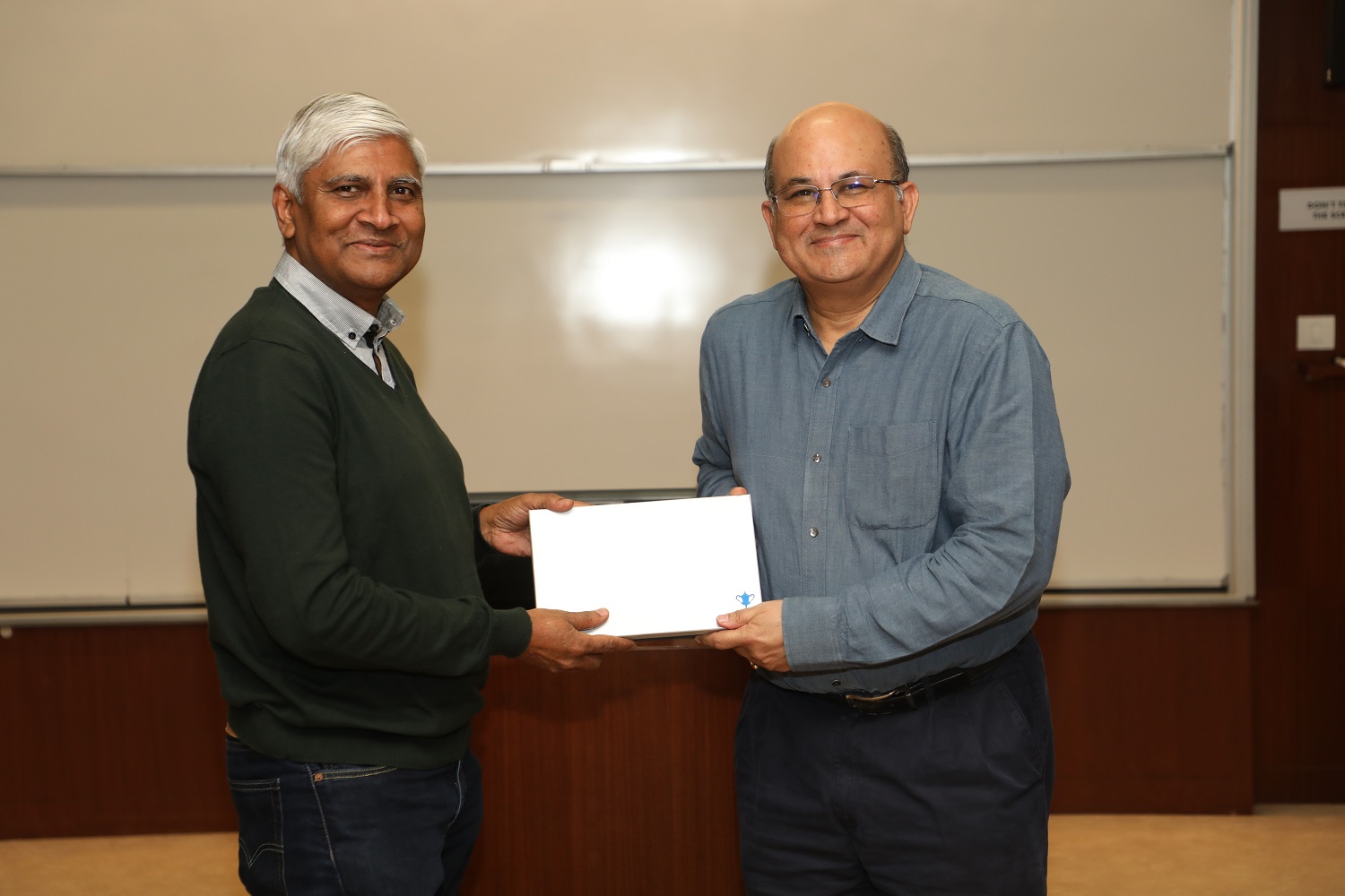 Prof. K. Kumar is felicitated by the IIMB Director, Prof. RT Krishnan.