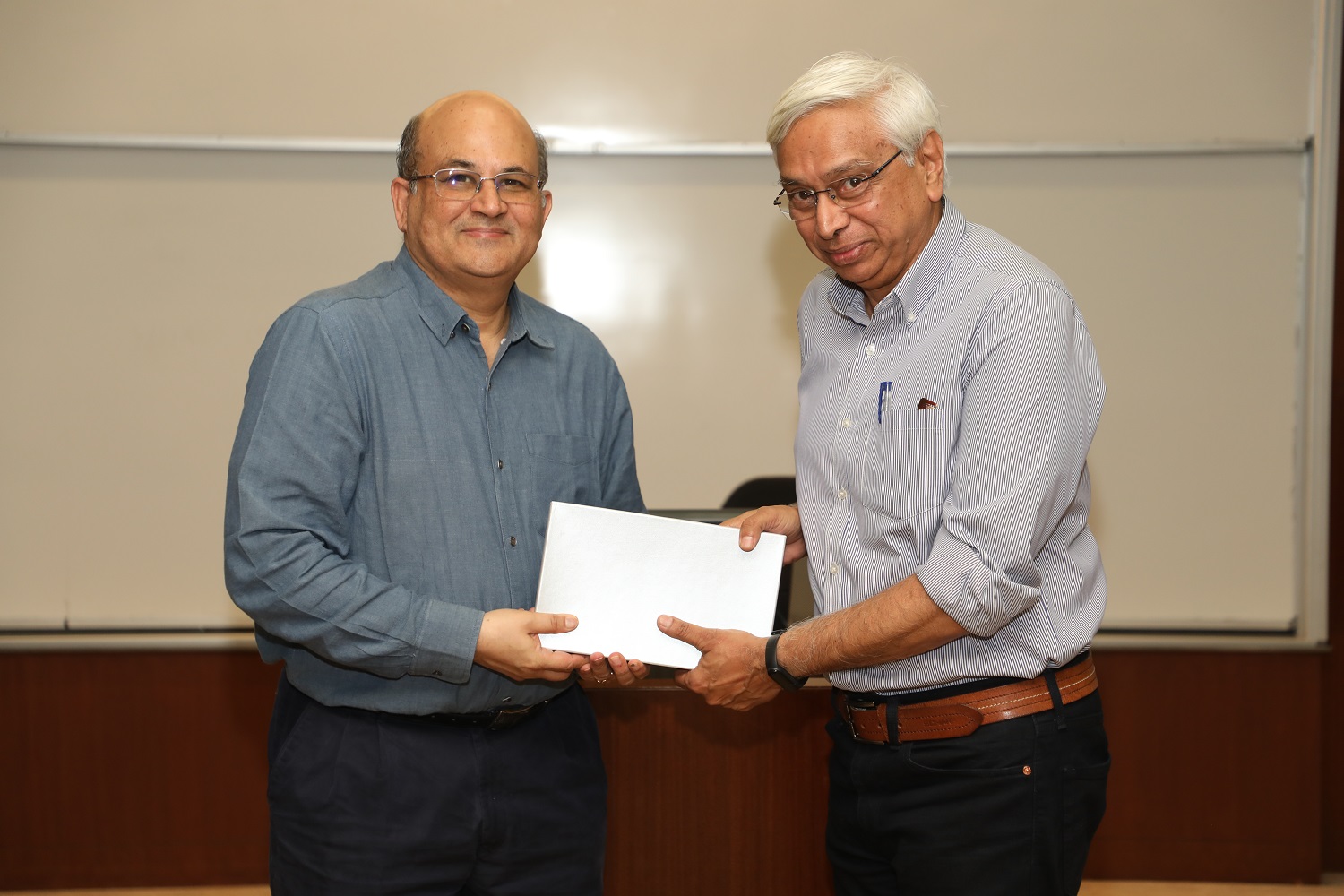 Prof. N. Bringi  Dev is felicitated by the IIMB Director, Prof. RT Krishnan.