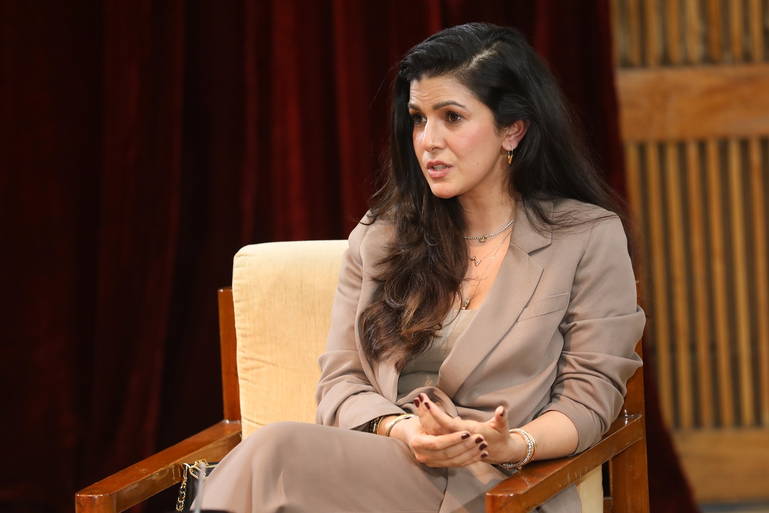 Actor Nimrat Kaur addresses the audience as part of the speaker series during Unmaad 2023, IIMB’s annual cultural festival.