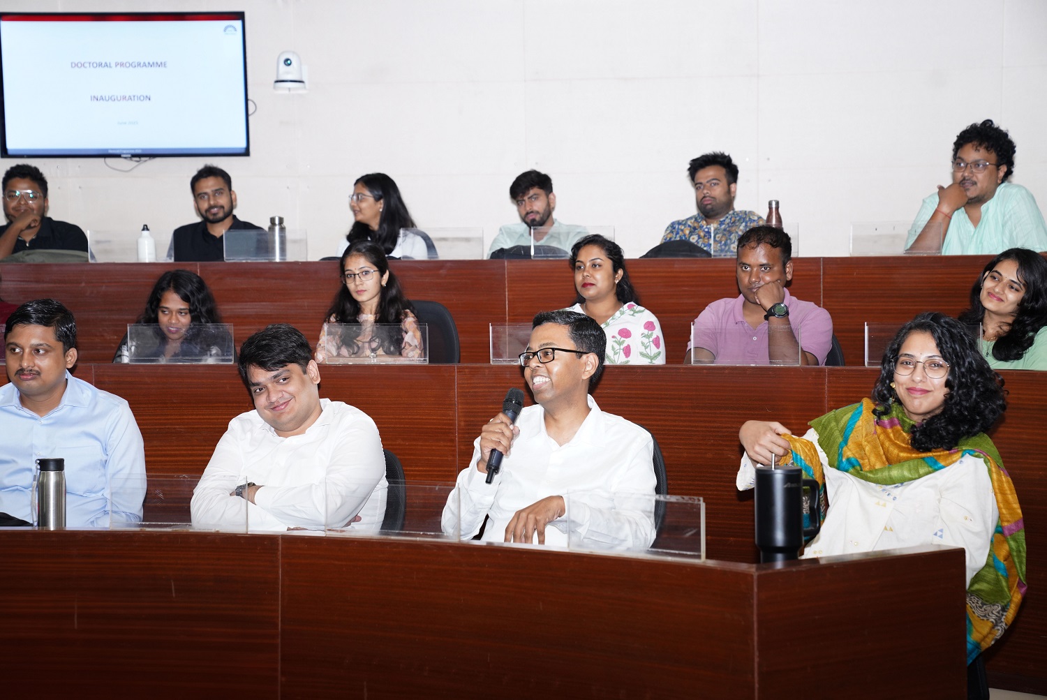 PhD students of the new cohort interact with senior IIMB faculty, during the inauguration on 9th June 2025.