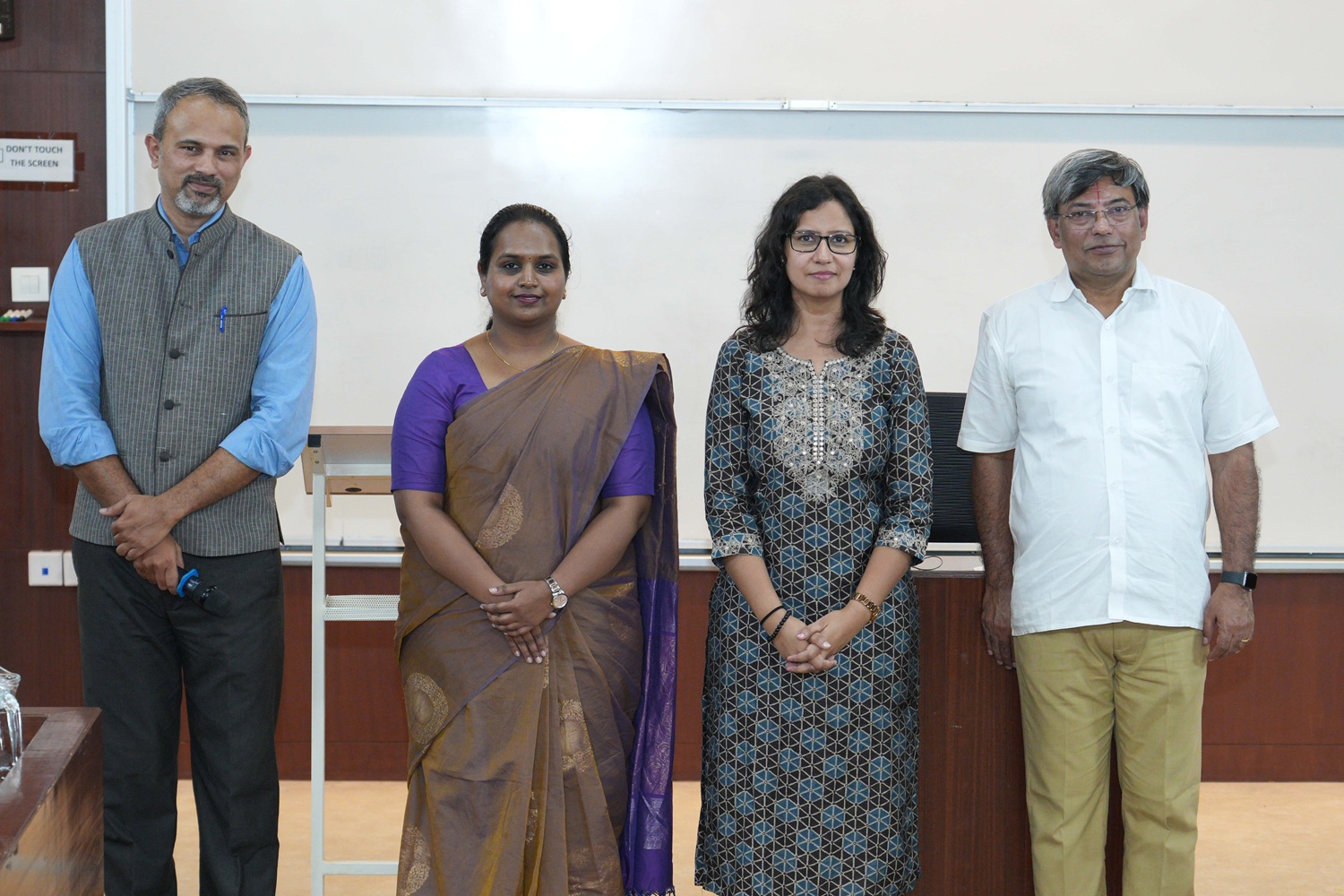 [L-R] A group picture of the authors of the ‘State of DPI in India’ report: Dr. Vikas N. Prabhu, IIMB PhD programme alumnus; Chaitrali Bhoi, Research Associate, CDPG; Anuradha Sharma, IIMB PhD programme scholar; and Prof. R Srinivasan, Chairperson, CDPG. 