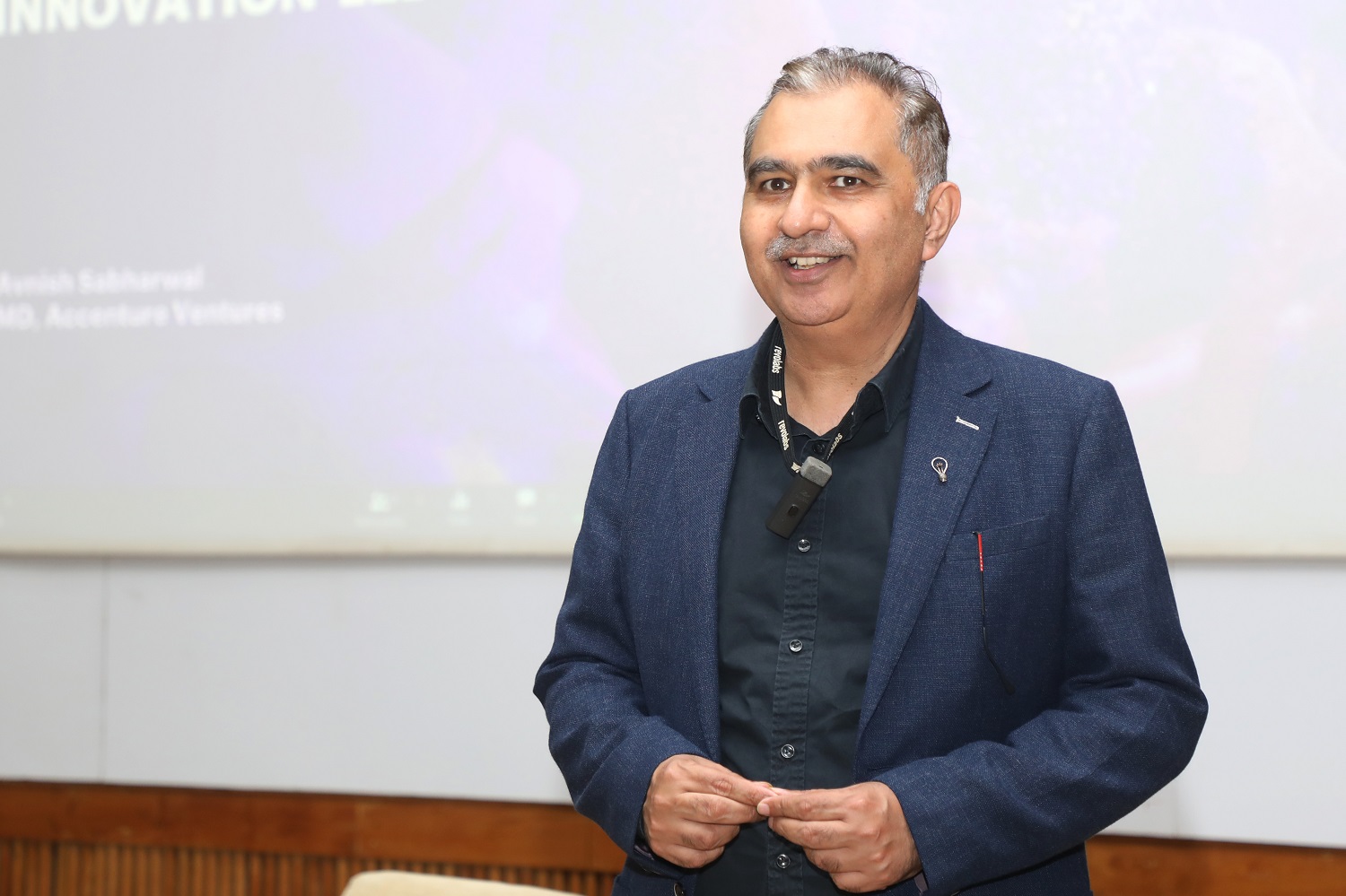 Avnish Sabharwal, Managing Director, Accenture Ventures and Open Innovation, speaks during the closing ceremony of Eximius 2022.