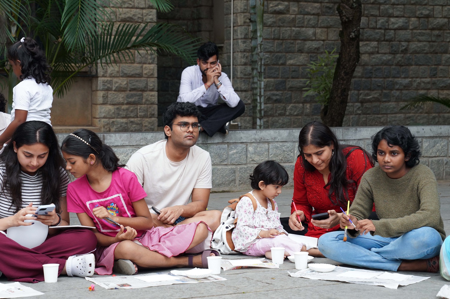 Children of non-staff members paint alongside IIMB students during the Canvas Art Workshop, by Fine Arts Society, IIMB, filling L-Square with colour and creativity.