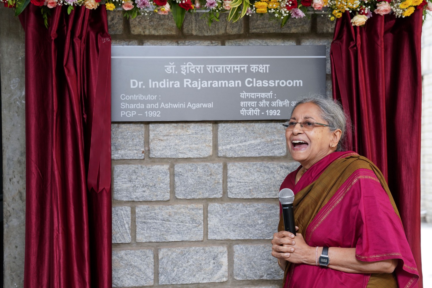 Classroom Q-003 is dedicated to Dr. Indira Rajaraman, former faculty from the Economics and Social Sciences area, by Sharda Agarwal and Ashwini Agarwal of PGP 1992, following which she reflects on her time at IIM Bangalore.