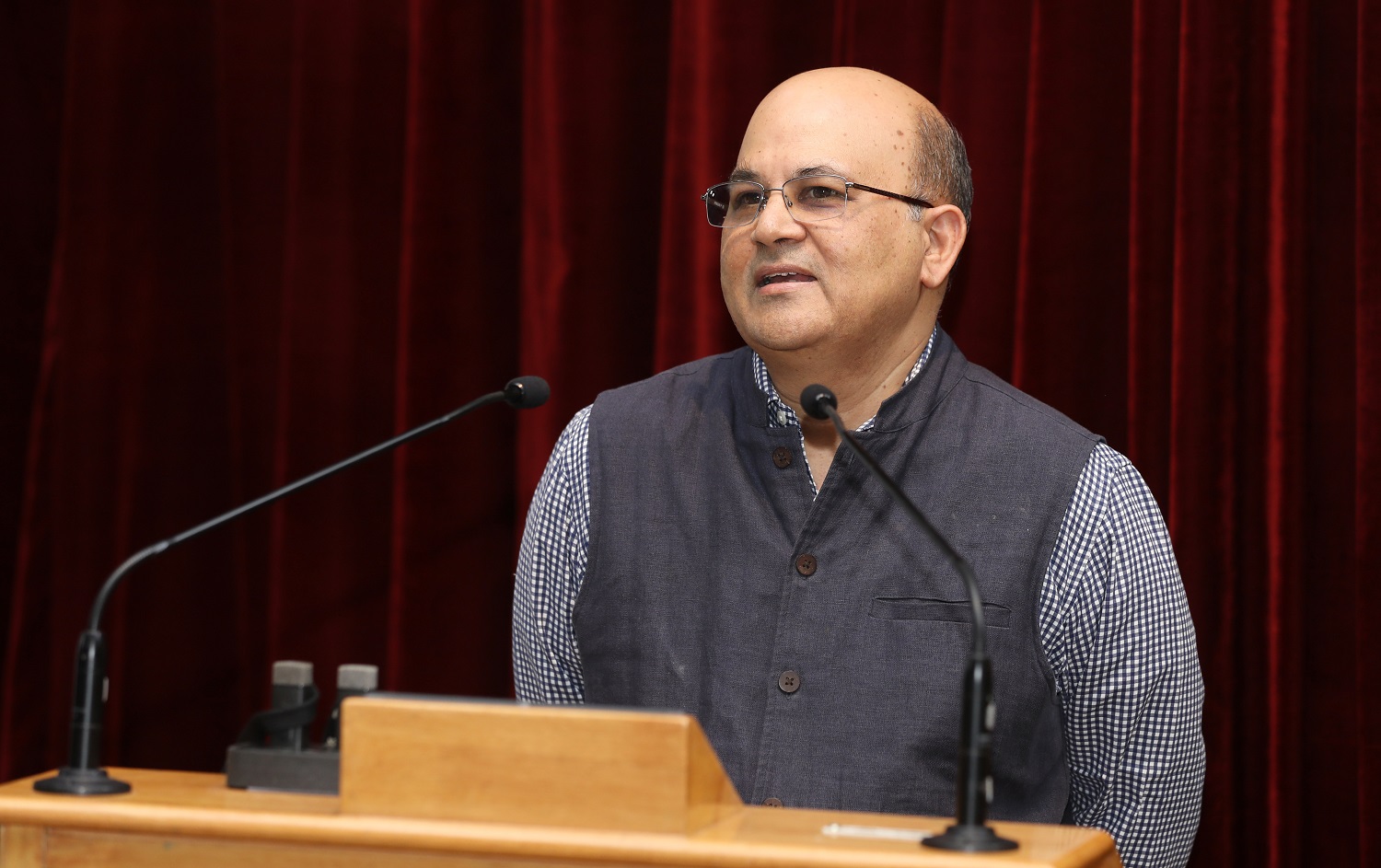 Prof. Rishikesha T Krishnan, Director, IIMB, congratulates the authors.