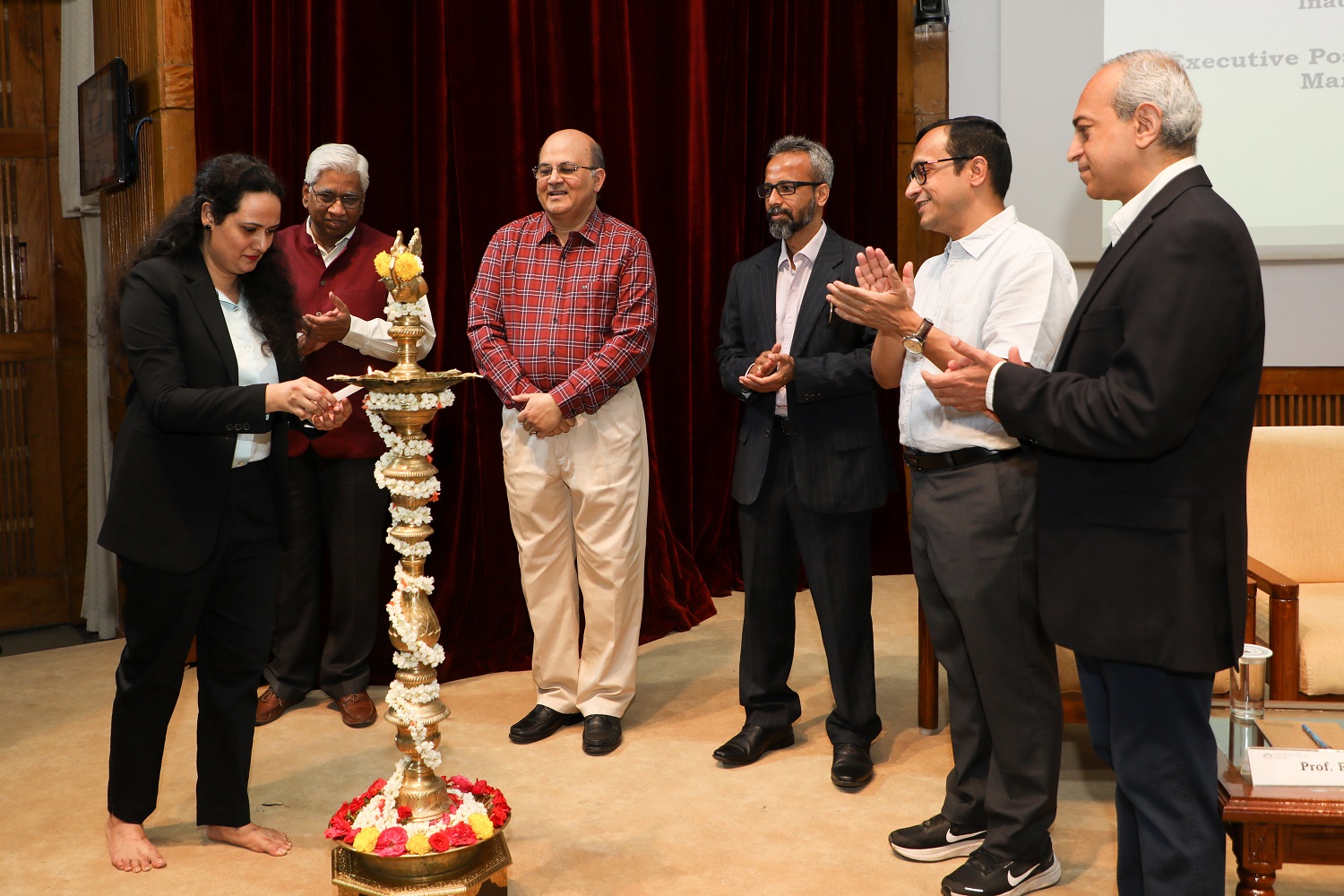 EPGP student lights the lamp at the inauguration of the EPGP Program on 25th March 2023. Prof. Rajendra K Bandi, Dean Administration, IIMB, Prof. Rishikesha T Krishnan, Director, IIMB, Amith Parameshwara, former Managing Director, Accenture Strategy and Consulting, Prof. Ashis Mishra, Chairperson, Admissions and Financial Aid, IIMB, Prof. Ashok Thampy, Chairperson, EPGP, IIMB, looks on.
