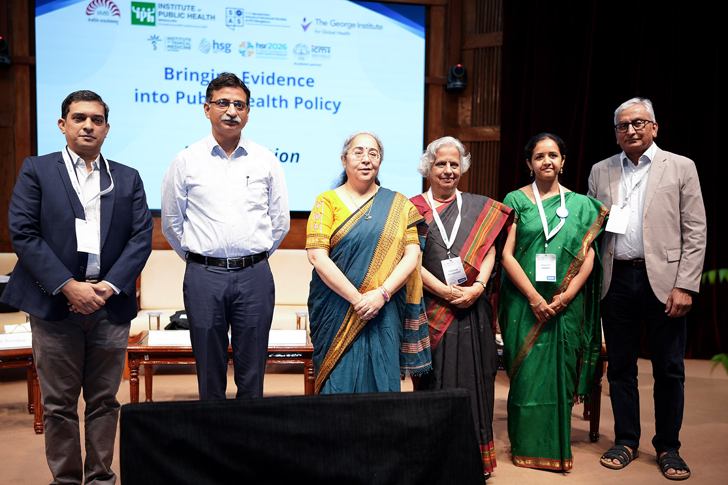 (L-R) Prof. Arnab Mukherji, Public Policy area and Chairperson of the PGPPM programme at IIMB; Mr. Ritvik Ranjanam Pandey, IAS, and Principal Secretary, Department of Health and Family Welfare, Government of Karnataka; Dr. Ashoo Grover, Scientist ‘G’ and Head, Division of Delivery Research, Indian Council of Medical Research (ICMR); Dr. Sundari Ravindran, Governing Board Member, IPH Bengaluru; Dr. Pragathi Hebbar, Dean, T.T. Narasimhan School of Advanced Studies, IPH Bengaluru; and Dr. Vivekanand Jha, Executive Director, The George Institute for Global Health, at the fifth edition of the Bringing Evidence into Public Health Policy (EPHP) Conference 2026 hosted at IIMB. 