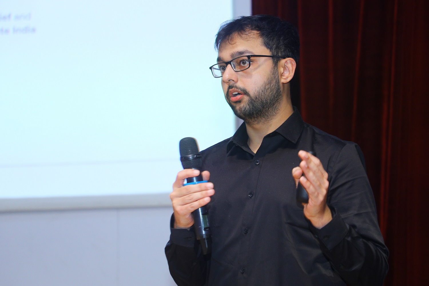 Gautam Kathuria, Head, Government Initiatives of Feeding India Foundation - a Zomato giveback, addresses the audience at the Social Impact Summit at IIMB.