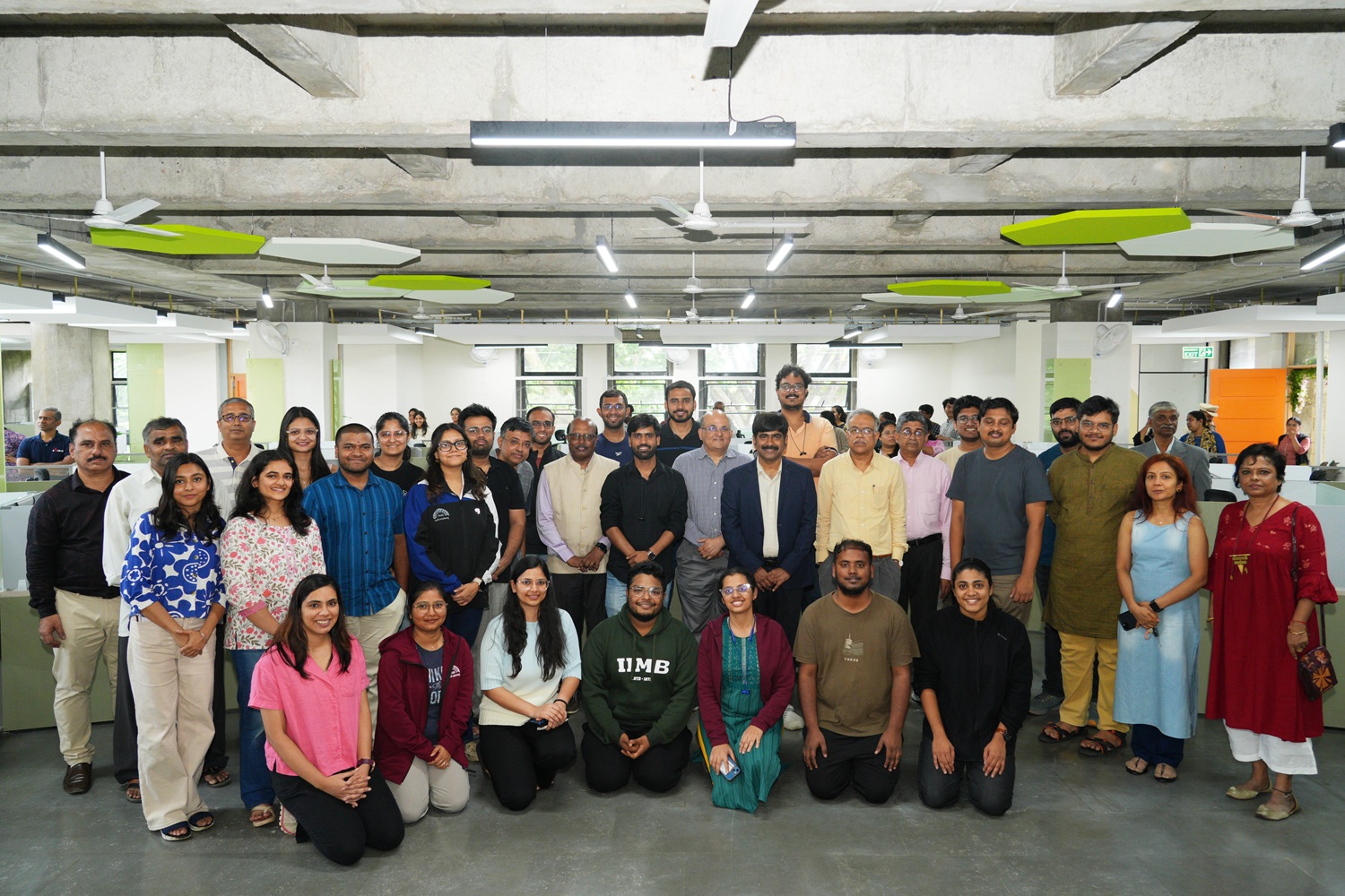 A group photo of the  PhD Scholars with the faculty and administrative staffs inside the new PhD Students’ Cubicles facility at IIMB Library.