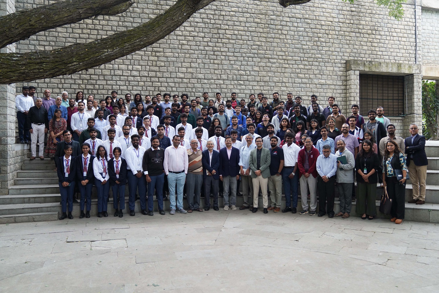 A group photo of the participants of the seminar with the speaker, along with faculty and senior officials of IIMB.