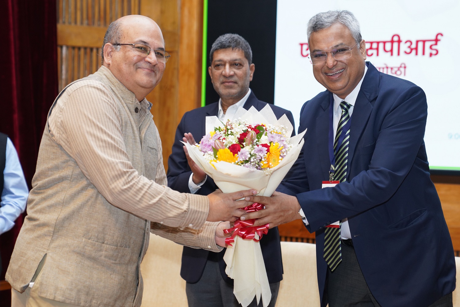 Prof. Rishikesha T Krishnan, Professor In-charge, New Campus, and faculty of the Strategy area, IIMB, greets Dr. Saurabh Garg (IAS), Secretary, Ministry of Statistics and Programme Implementation, GoI, at the symposium. 