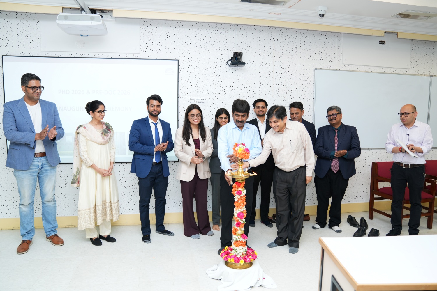Prof. U. Dinesh Kumar, Director-in-Charge, IIM Bangalore, along with Prof. Anil B. Suraj, Chairperson, N.S. Ramaswamy Pre-doctoral Fellowship Programme inaugurates the PhD and NSR Pre-doc orientation ceremony by lighting the ceremonial lamp on 8 June 2026.