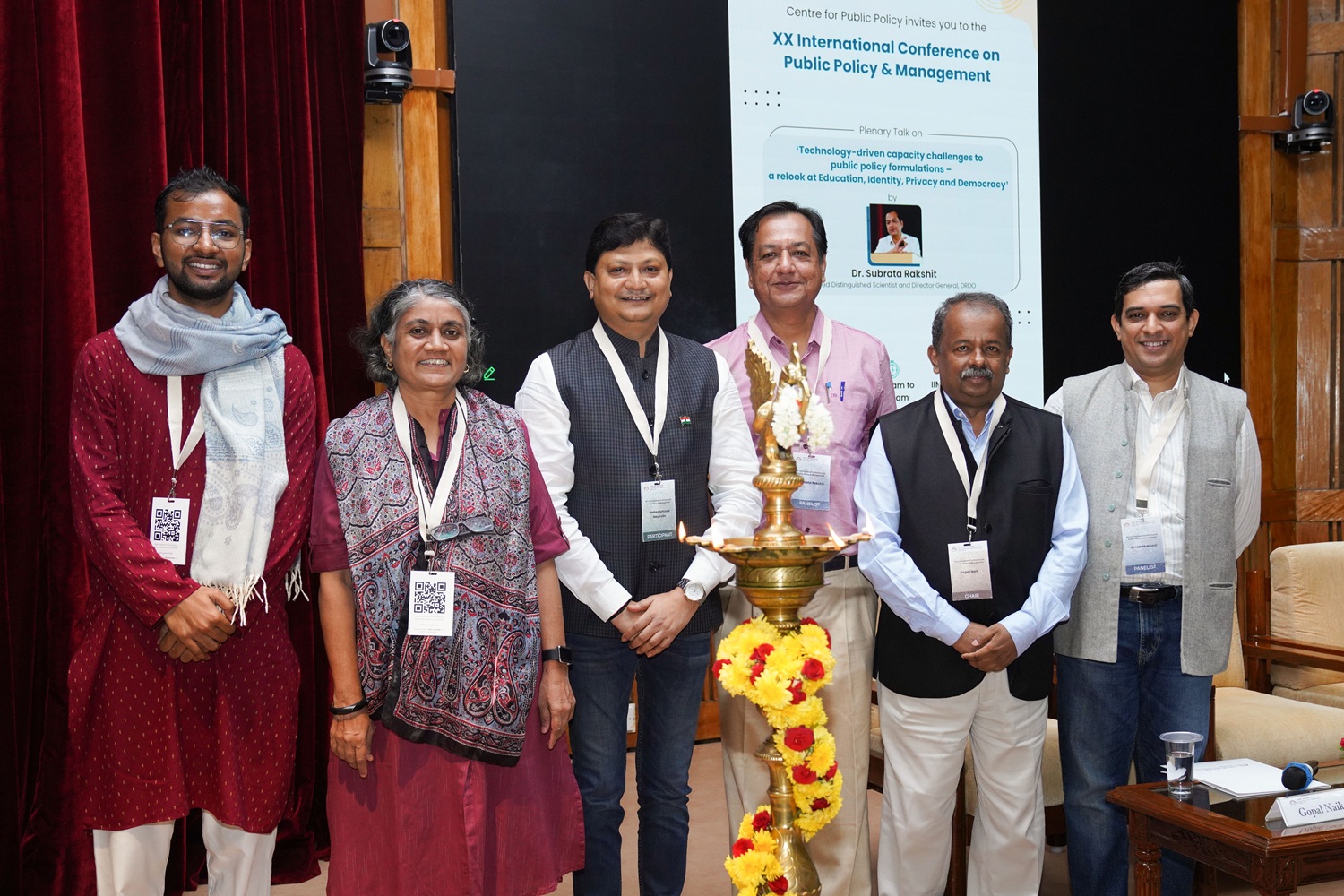 Prof. Rajalaxmi Kamath, Chairperson, Internal Committee and faculty of the Public Policy area, IIMB; Dr. Subrata Rakshit, Retired Distinguished Scientist and Director General, Defence Research and Development Organisation; Prof. Gopal Naik, Chairperson, Senior Fellow and Jal Jeevan Mission Chair Professor at the Centre for Public Policy, IIMB, and Prof. Arnab Mukherji, Chairperson, Post Graduate Programme in Public Policy & Management and faculty of the Public Policy area of IIMB, along with participants, at the inauguration of the XX International Conference on Public Policy & Management, being hosted by IIM Bangalore’s Centre for Public Policy from 19 to 21 August 2025.