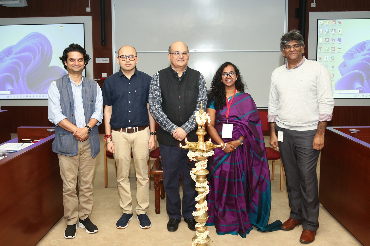 (L-R) Prof. Abhinav Anand, Finance & Accounting area, IIMB; Prof. Tarun Jain, Chairperson and faculty, Production & Operations Management area, IIMB; Prof. Rishikesha T Krishnan, Director, IIMB; Pavithra I, Research Associate, IIMB; M S Ganesh, General Manager, Capacity Supply Chain & Provisioning, Microsoft Azure, lights the lamp to inaugurate the Eighth Biennial Supply Chain Management Conference on 5th January 2024.