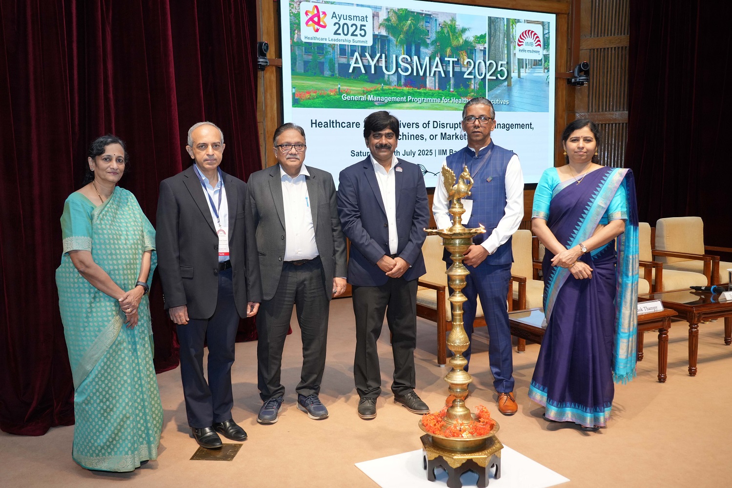 (L-R) Prof. Padmini Srinivasan, Finance & Accounting area; Prof. Ashok Thampy, Finance & Accounting area; Jawaid Akhtar, IAS, Ex–Additional Chief Secretary of Health and Family Welfare, GoK; Prof. Dinesh Kumar, Director-In-Charge, IIMB; Dr. Amrut Kadam, Deputy Director, Rajiv Gandhi University of Health Sciences; Prof. Haritha Saranga, Production & Operations Management (POM) area, inaugurating the launch of the annual healthcare leadership summit: Ayusmat 2025.