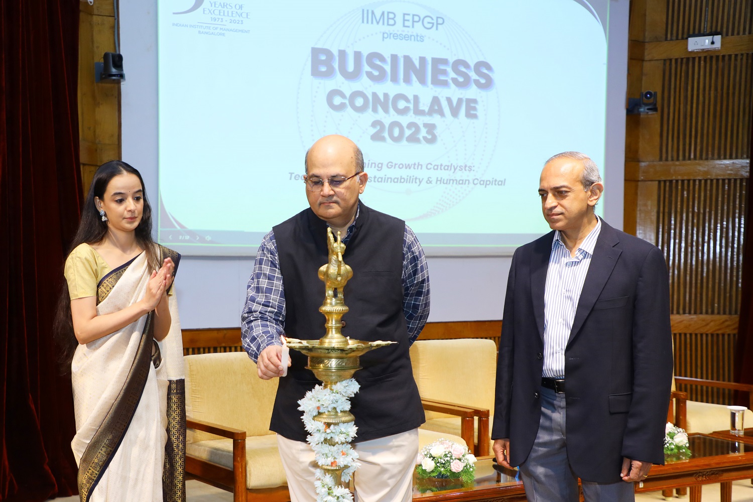Professor Rishikesha T. Krishnan, Director of IIM Bangalore, lights the ceremonial lamp to inaugurate the EPGP Business Conclave 2023, organized by the Executive Post Graduate Programme in Management (EPGP) at IIMB, the event focuses on 'Unleashing Growth Catalysts: Technology, Sustainability & Human Capital' on 24th September.