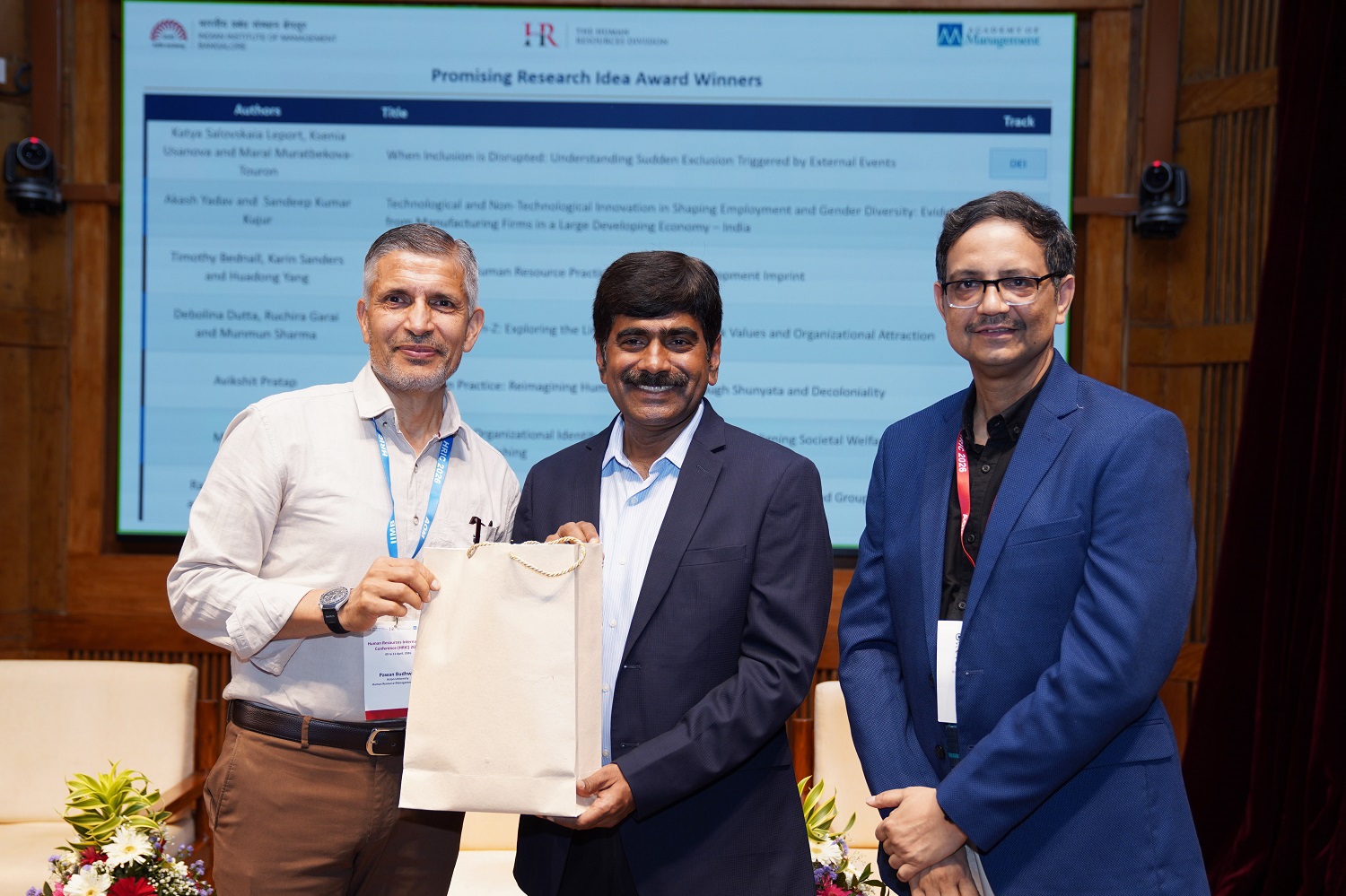 Conference Co-conveners Prof. Pawan Budhwar and Prof. Sushanta K Mishra felicitate Prof. U Dinesh Kumar, at the conclusion of the sixth Human Resources International Conference at IIMB, on 11th April 2026.