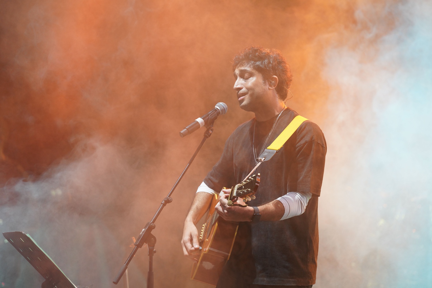 Singer Nikhil D'Souza captivates the audience during the Pro-Nite event with his live performance.