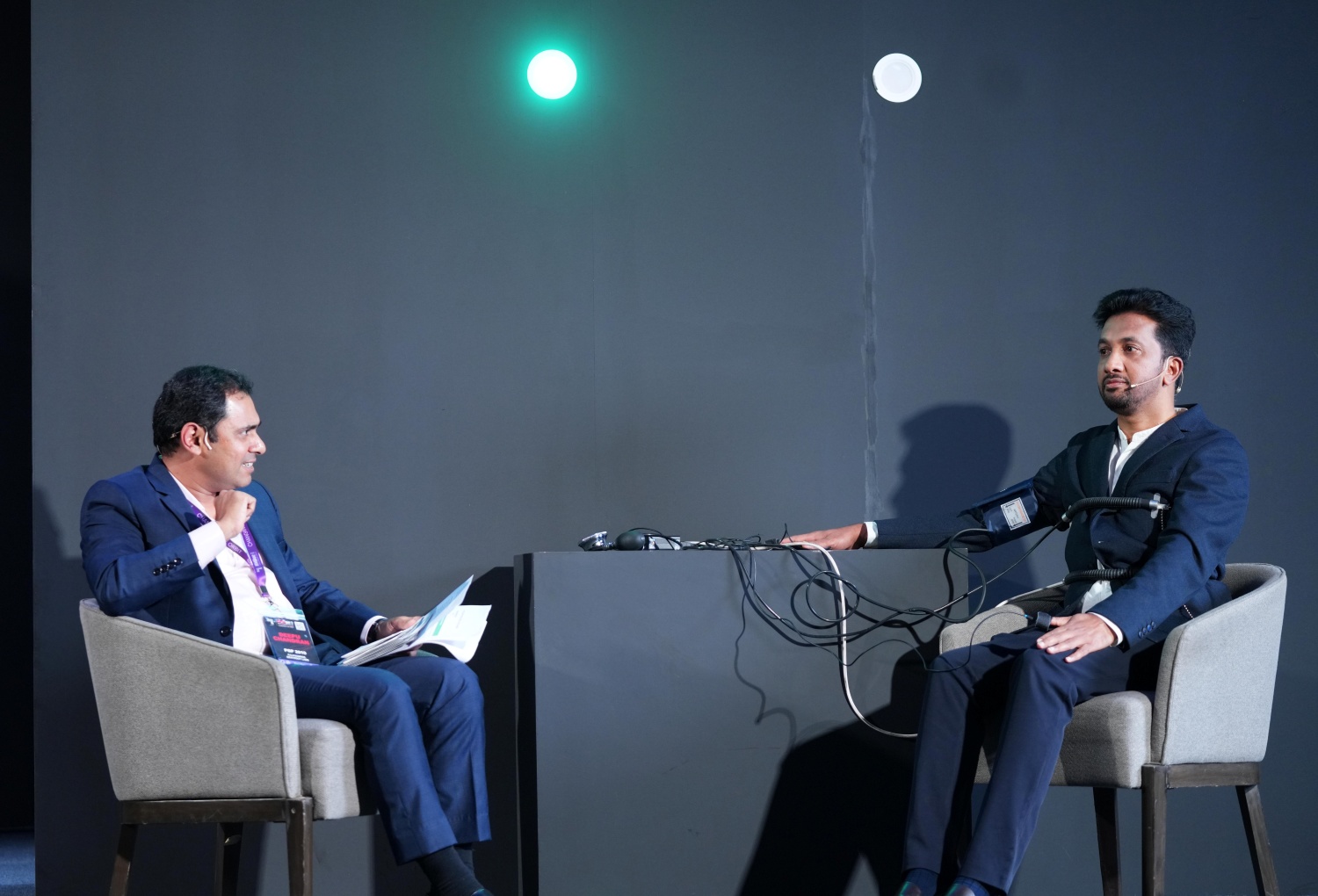 (L-R) Deepu Chandran, PGP 2010, hosts Truth or Beat, as PC Musthafa, PGSEM '07, Chairman & Global CEO, iD Fresh Food, takes on a live polygraph test before an enthralled audience.