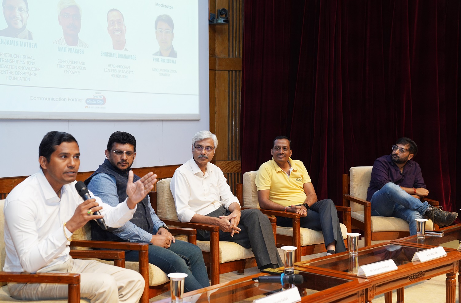 (L-R): Kadali Anand Kumar, Director and Board Member of Annapoorna Trust; Benjamin Mathew, President, Rural Transformation and Innovation Knowledge Center, Deshpande Foundation; Amit Prakash, Co-founder and Trustee, Vision Empower Trust; Shrishail Dhanawade, Head of Program Leadership, Agastya International Foundation, and Prof. Prateek Raj, faculty from the Strategy area, IIMB, at the panel discussion on, 'Sustainability as a Service: NGOs Driving Community-led Solutions'.