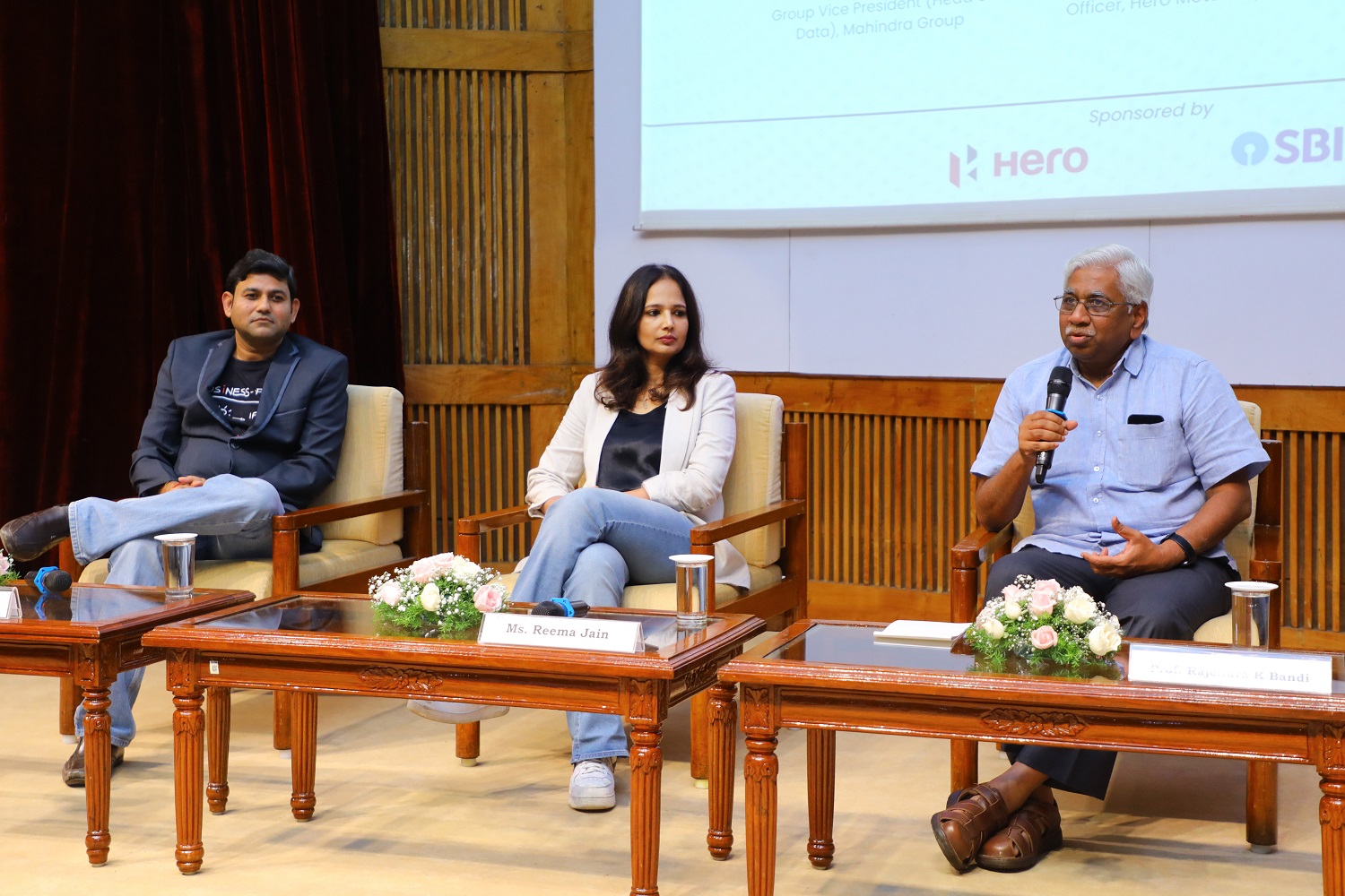 Prof. Rajendra K Bandi, Dean, Administration, IIMB, moderated the panel discussion on "Navigating Digital Transformation: Strategies and Challenges for Modern Business Incumbents". (L-R) Vineet Shukla, Group Vice President (Head of Data), Mahindra Group; Reema Jain, Chief Information & Digital Officer, Hero MotoCorp and Prof. Rajendra K Bandi.