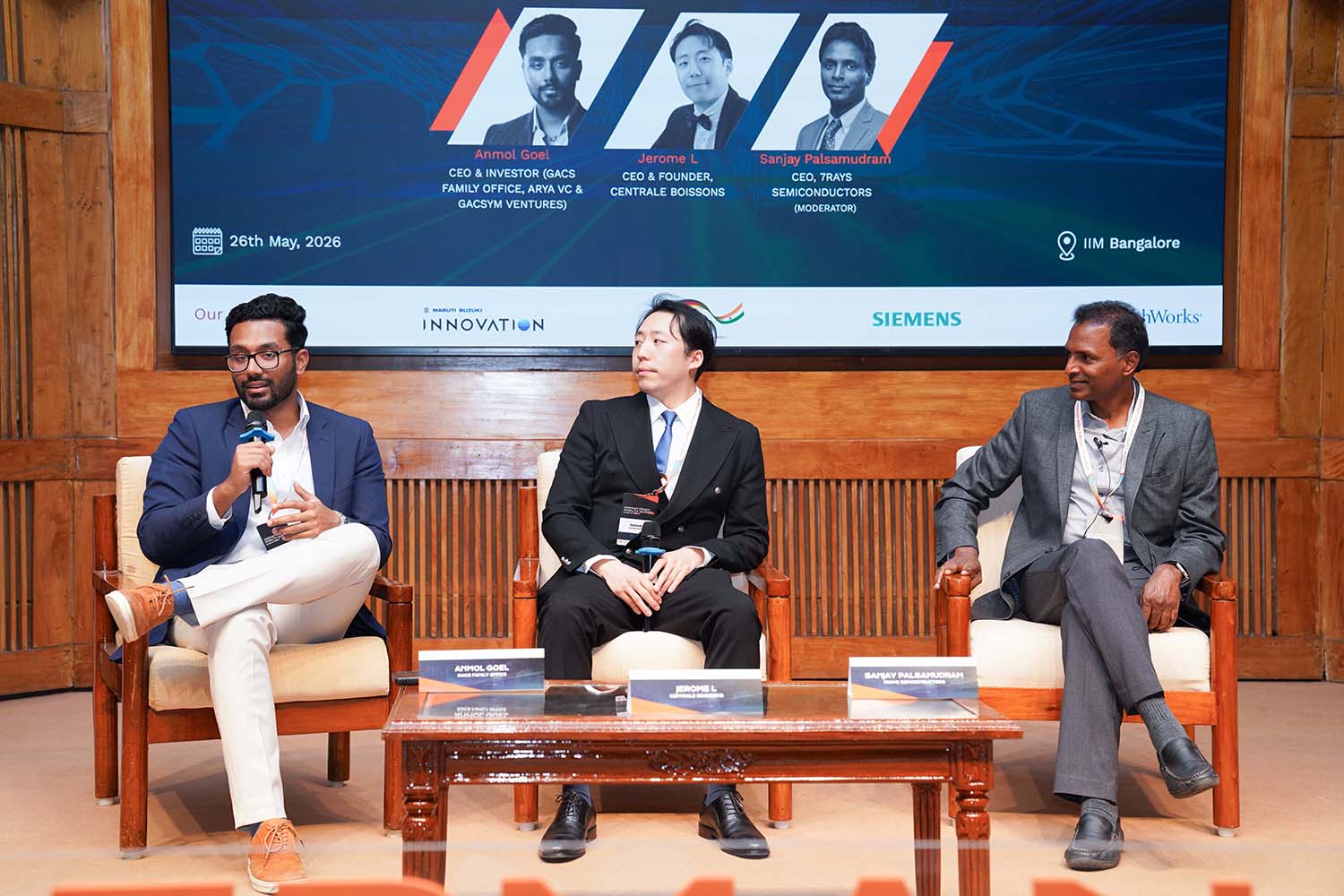 (L-R): Anmol Goel, CEO & Investor, GACS Family Office, Arya VC and Gacsym Ventures; Jerome L, CEO and Founder, Centrale Boissons and Sanjay Palsamudram, CEO, 7Rays Semiconductors (moderator), during a panel discussion on, ‘How Family Offices Are Fuelling the Next Generation of Entrepreneurship’, at the German Indian Mobility Summit 2026 at IIM Bangalore, on 26th May 2026.
