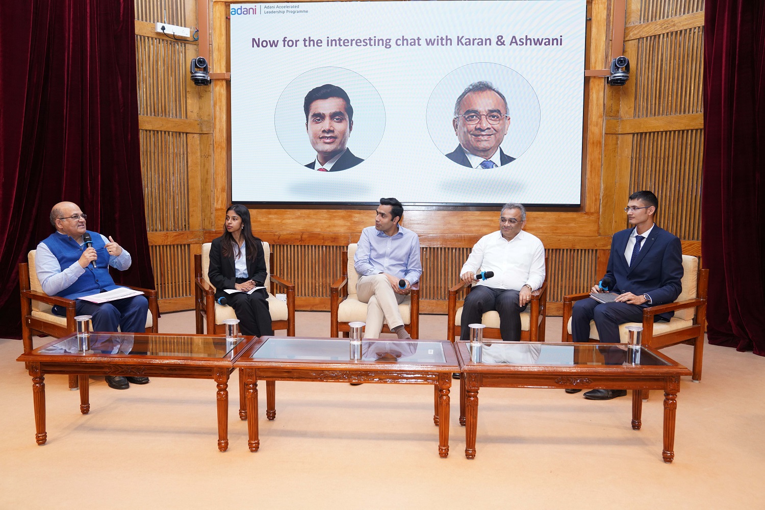 (L-R) Prof. Rishikesha T. Krishnan, Professor In-charge, New Campus, IIMB; PGP-1 student Bhavika Waghdhare; Mr. Karan Adani, Managing Director, Adani Ports and SEZ Ltd.; Mr. Ashwani Gupta, CEO, Adani Ports and SEZ Ltd; and PGP-1 student Rutvik Baxi during a panel discussion on the Adani Group’s future focus areas.