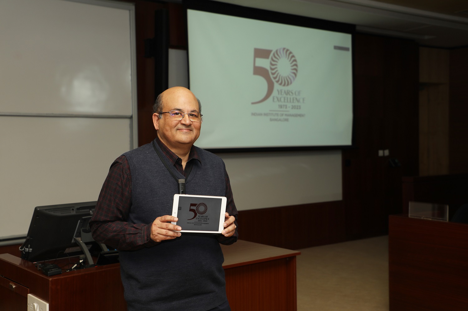 Prof. Rishikesha T Krishnan, Director, IIMB, reveals the Golden Jubilee logo of IIMB on 28 December 2022