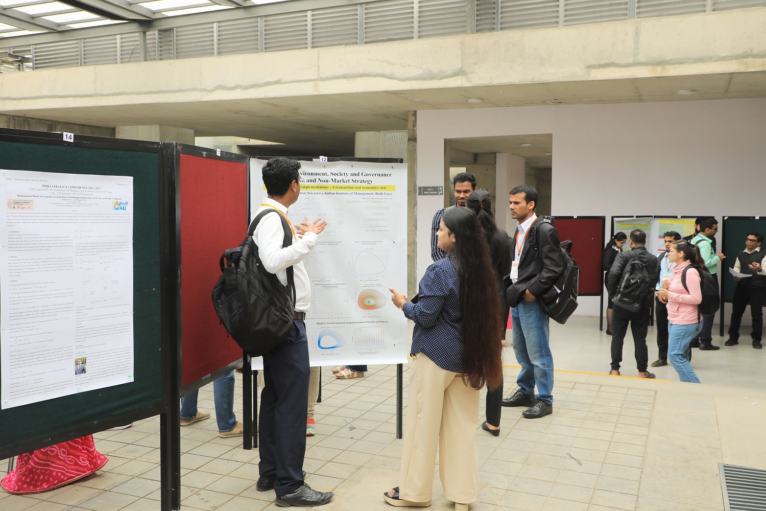 Vibrant posters showcasing the diverse research topics of the presented papers during the conference.