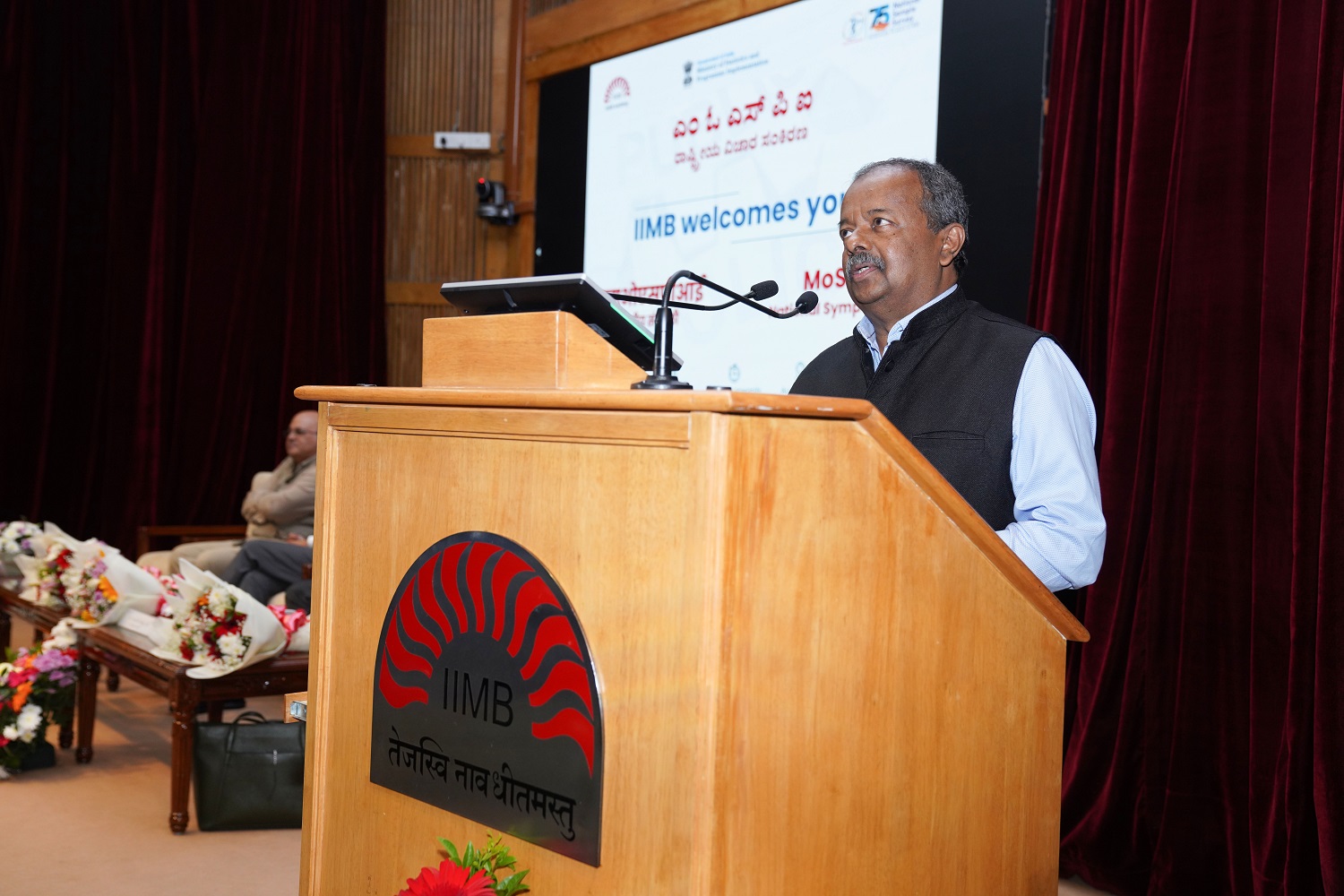 Prof. Gopal Naik, Chairperson, Senior Fellow and Jal Jeevan Mission Chair Professor at the Centre for Public Policy, IIMB, during his address at the symposium.