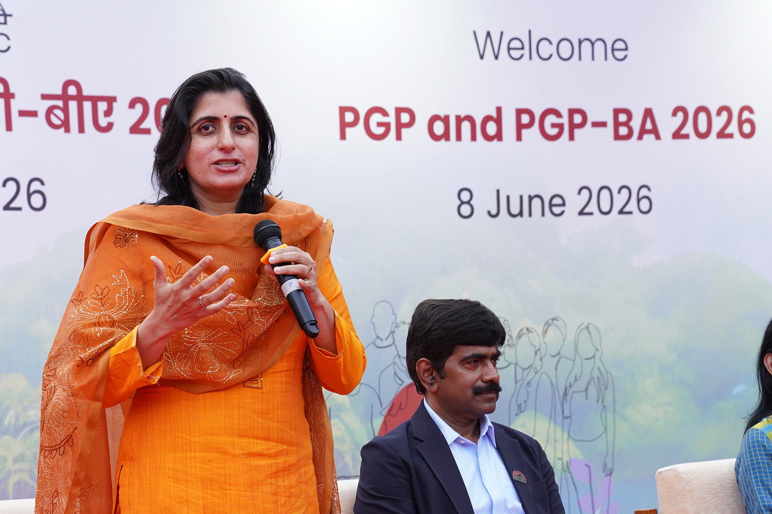 Prof. Manaswini Bhalla, Chairperson, Post Graduate Programme in Management and PGP in Business Analytics, and faculty of the Economics area, explains the new students how their IIMB journey will define and redefine them, during her welcome address to the PGP and PGPBA 2026-28 cohorts, at the inauguration on 8th June 2026.  