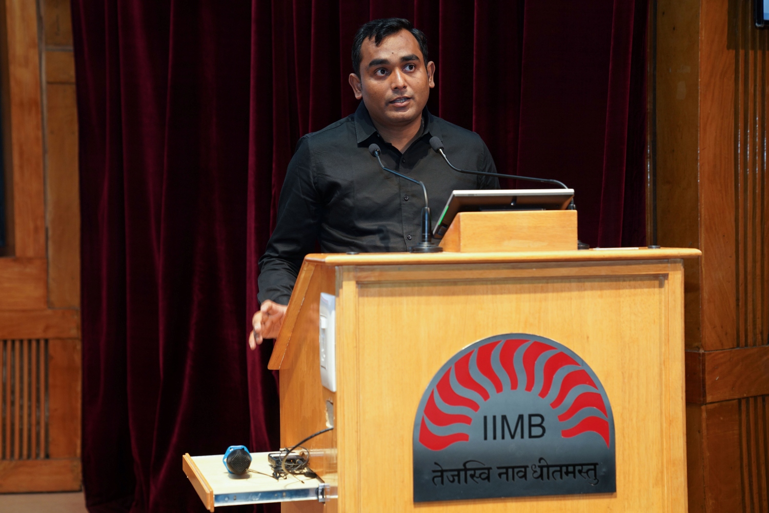 Prof. Mayank Kumar, Chairperson, Centre for Software & Information Technology Management (CSITM), IIMB, delivers the welcome address at the panel discussion on ‘From Known Unknowns to Hidden Threats: Navigating India’s New Cyber Reality’ held on 14 July, 2026, IIMB auditorium.