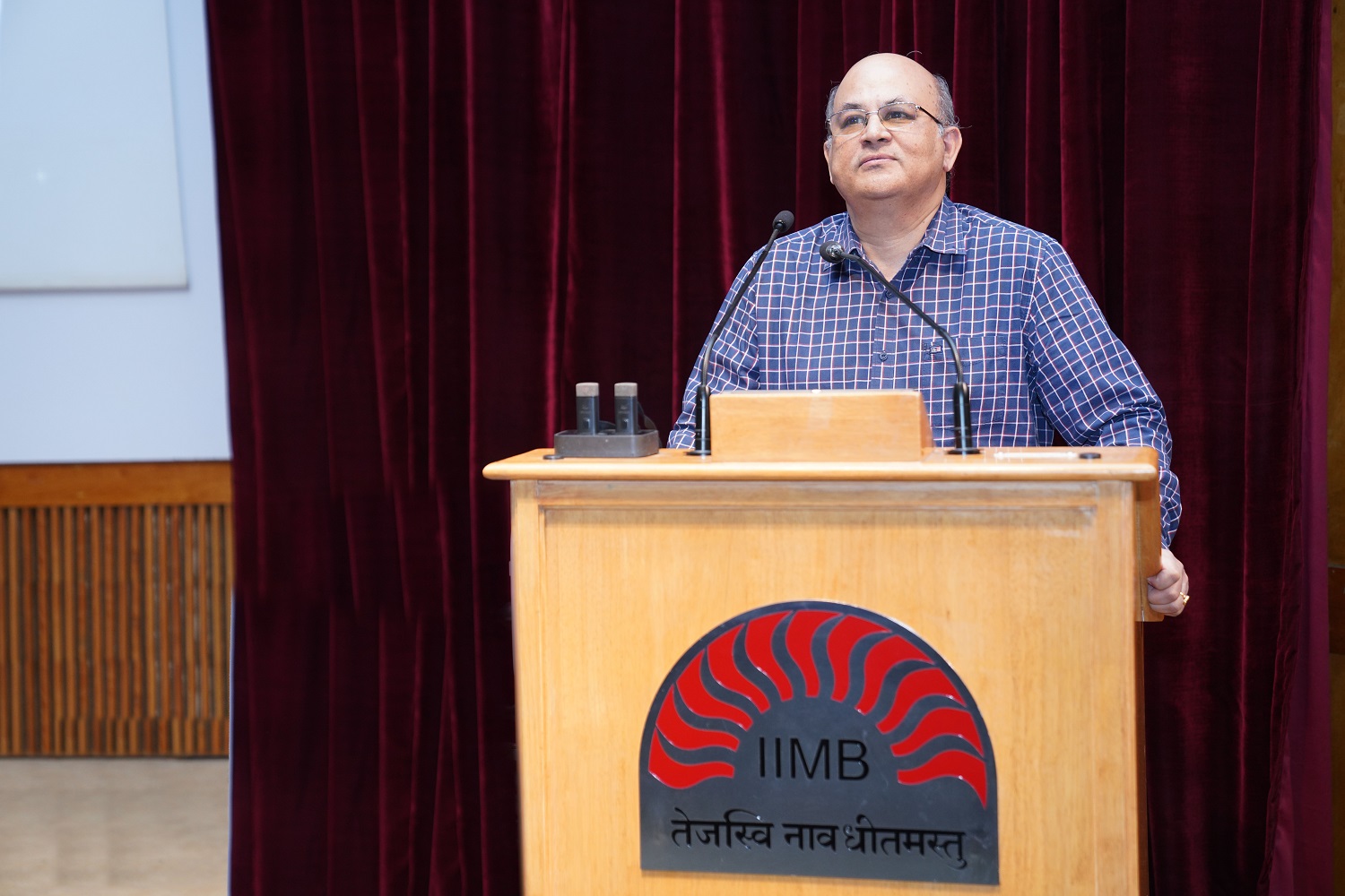 Prof. Rishikesha T. Krishnan, Director of IIM Bangalore, welcomes the speakers and participants to Eximius 2024. 