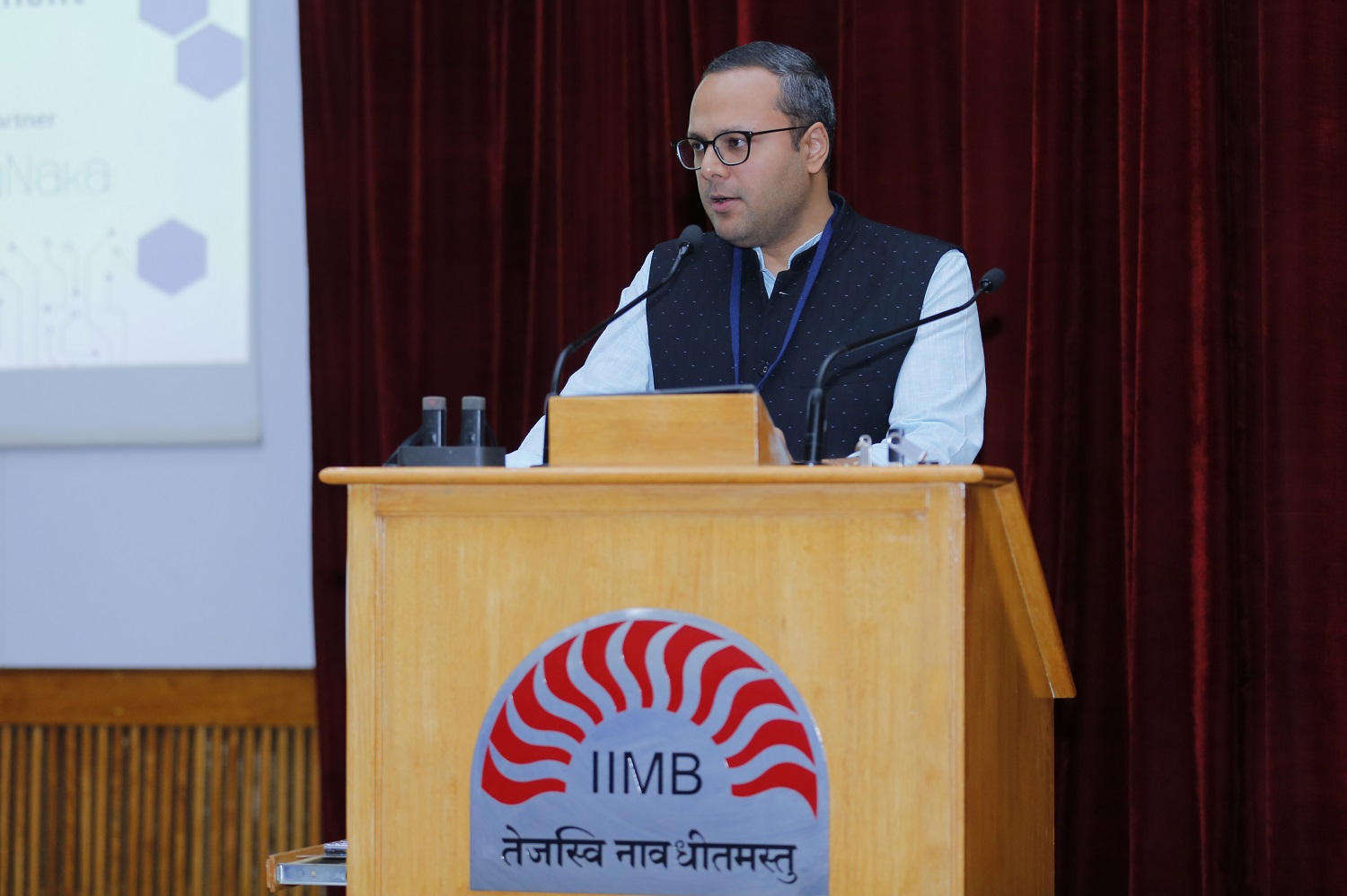 Prof. Shankhadeep Banerjee, Chairperson of the Centre for Software & Information Technology Management as well as IT Facilitation Committee and faculty of the Information Systems area of IIMB, delivers the welcome address at the India Software Product Management Summit 2024.