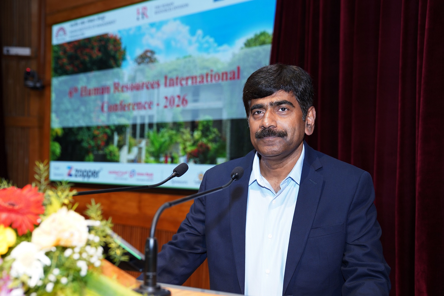 Prof. U Dinesh Kumar, Director-in-charge, IIM Bangalore, observes that a deeper debate is needed on the extent to which AI should be used, during his address at the valedictory ceremony of the sixth Human Resources International Conference at IIMB, on 11th April 2026. The conference was themed on: ‘Sustainable Human Resource Management in the Age of Disruption’.