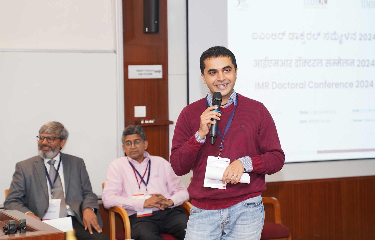 Professor Aditya Shrinivas, a faculty member from the Economics area at IIMB, introduces the keynote speaker to the audience.