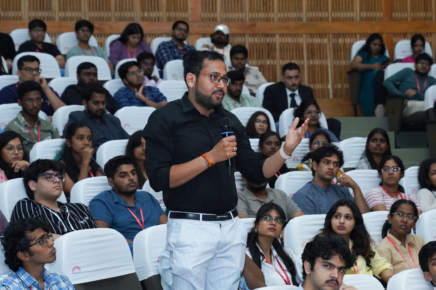 A participant engaging during the Q&A of a session.