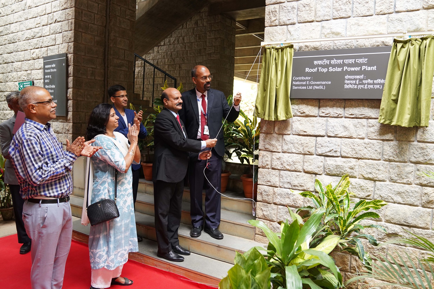 L-R: Prof. M Jayadev, Dean Administration, Prof. Haritha Saranga, Chairperson, Sustainability Taskforce, Prof. Sourav Mukherji, Dean  Alumni Relations & Development, Ashok Chandra, Executive Director, Canara Bank, and Debajyoti Ray Chaudhuri, MD and CEO, National E-Governance Services Ltd, inaugurate the rooftop solar power plant on April 19, 2024. 