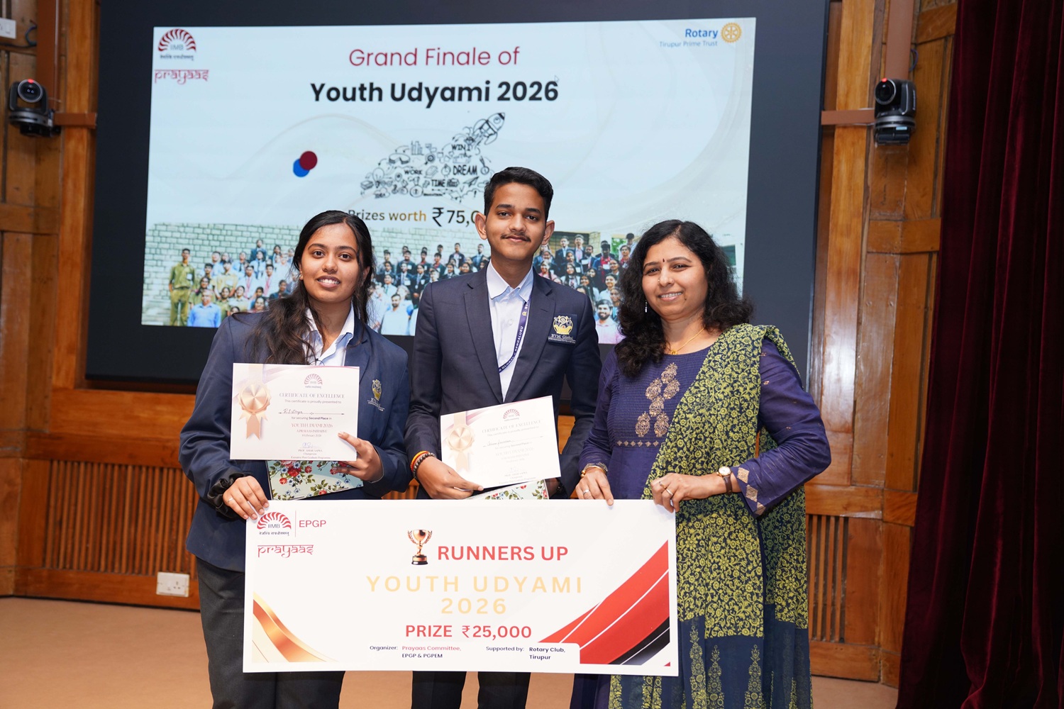 Prof. Haritha Saranga, Production & Operations Management area, presenting the runner-up award to Team BVM Global School, Bengaluru.