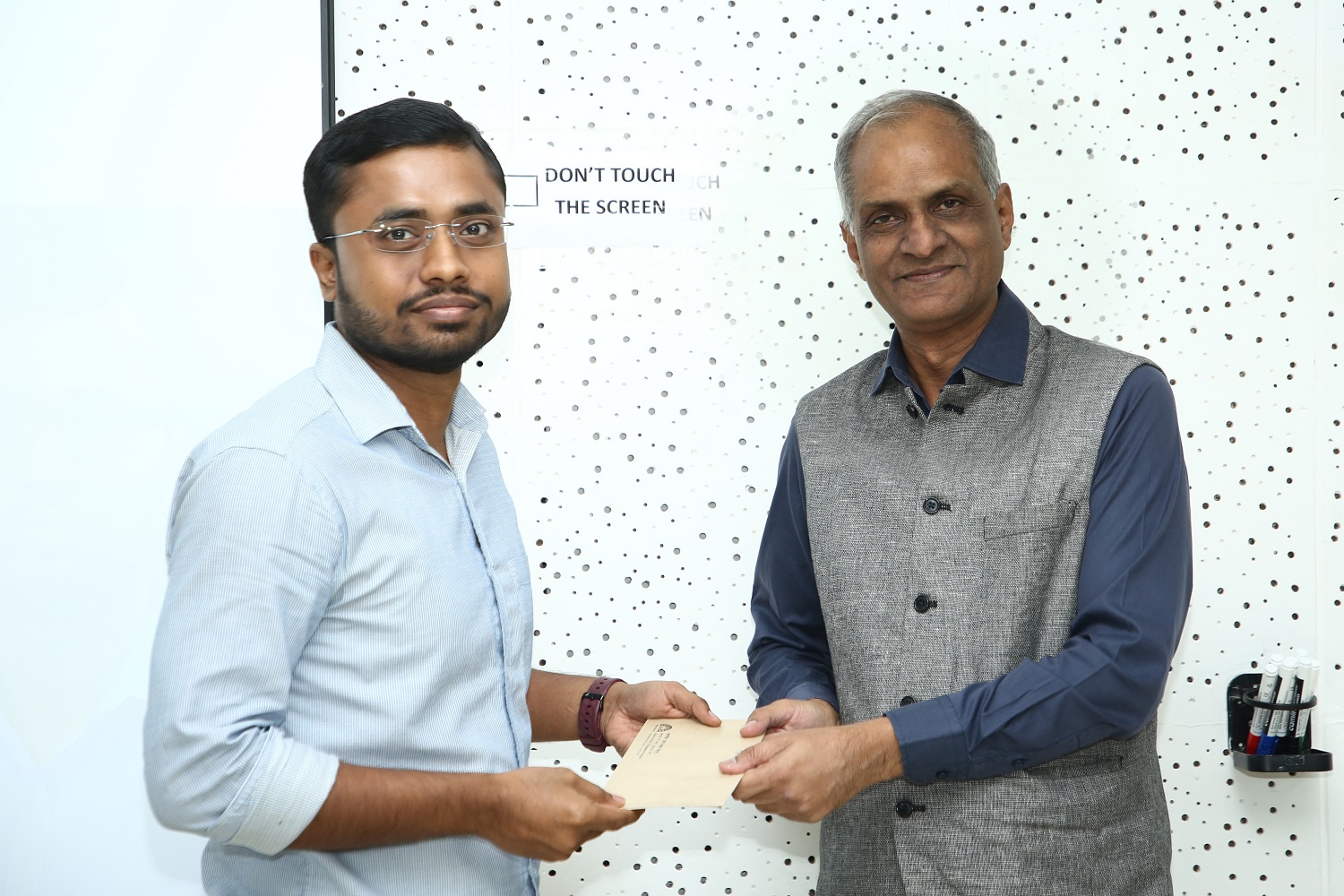(L-R) PhD student Satyajit Roy of the POM area received the WIPRO Sustainability Fellowship from P.S. Narayan, Global Head - Sustainability and Societal Initiatives, Wipro.