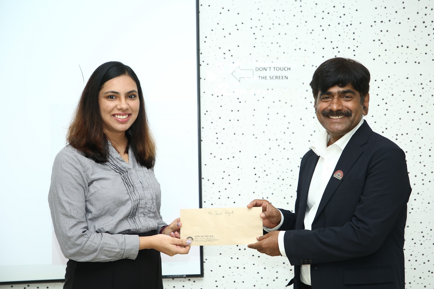 (L-R) PhD student Sonal Nayak of the Strategy area received the Mirae Asset Scholars Award from Prof. Dinesh Kumar, Director-In-charge, IIMB.